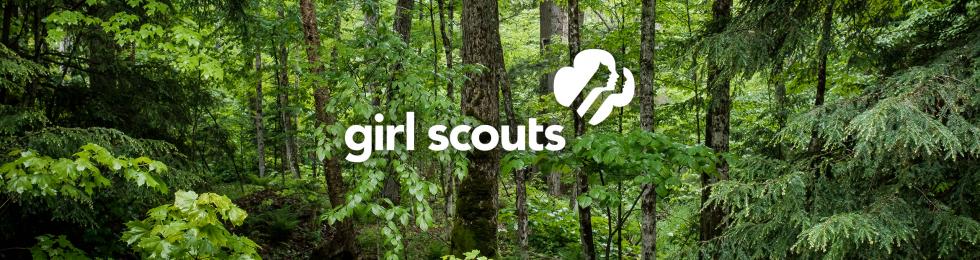 Girl Scouts logo superimposed on forest scene.