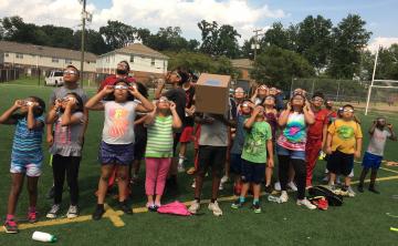 ABCD Camp attendees looking at solar eclipse.